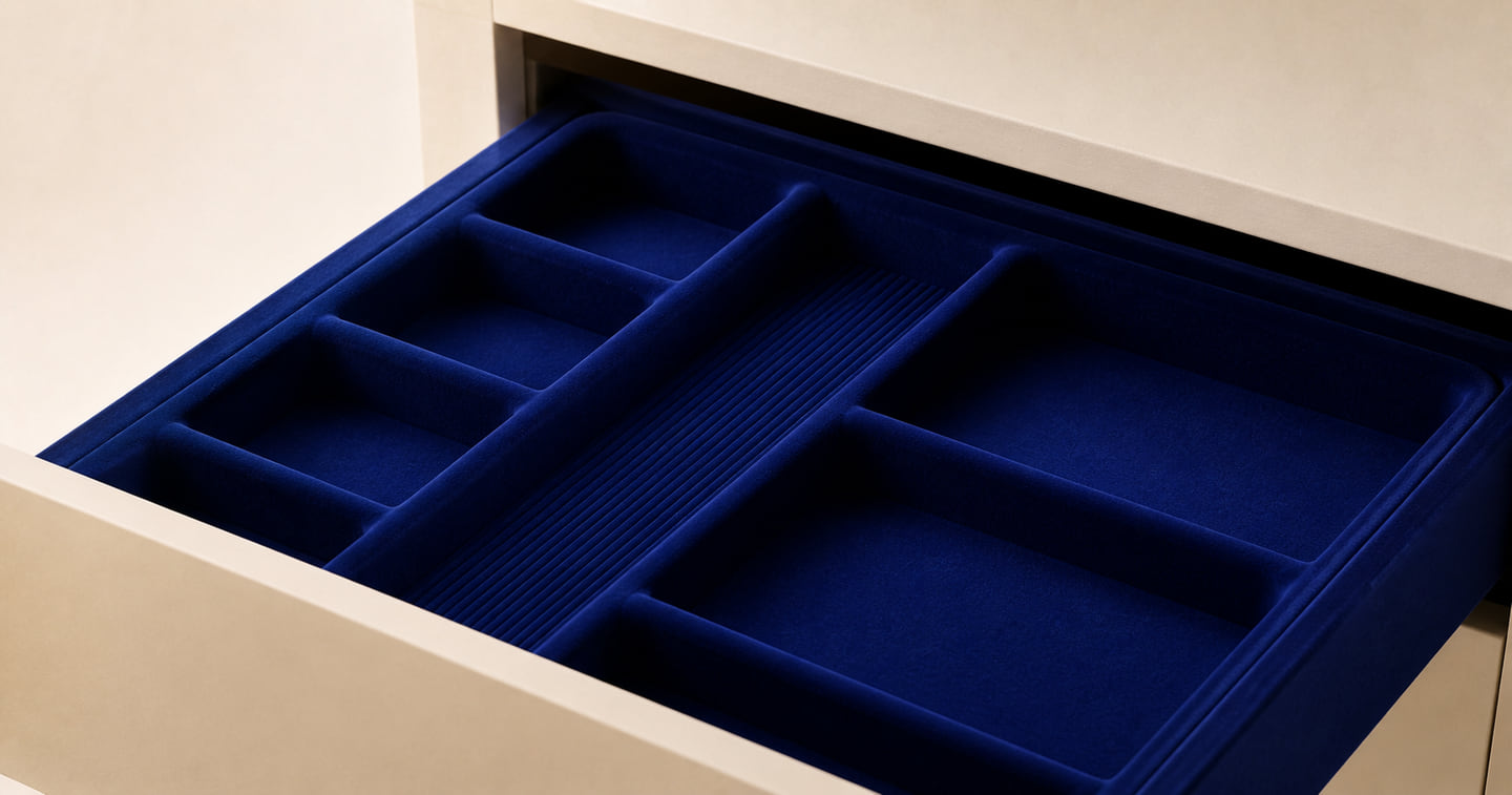 Compartmented drawer interior finished in Lazuli Blue velvet flock